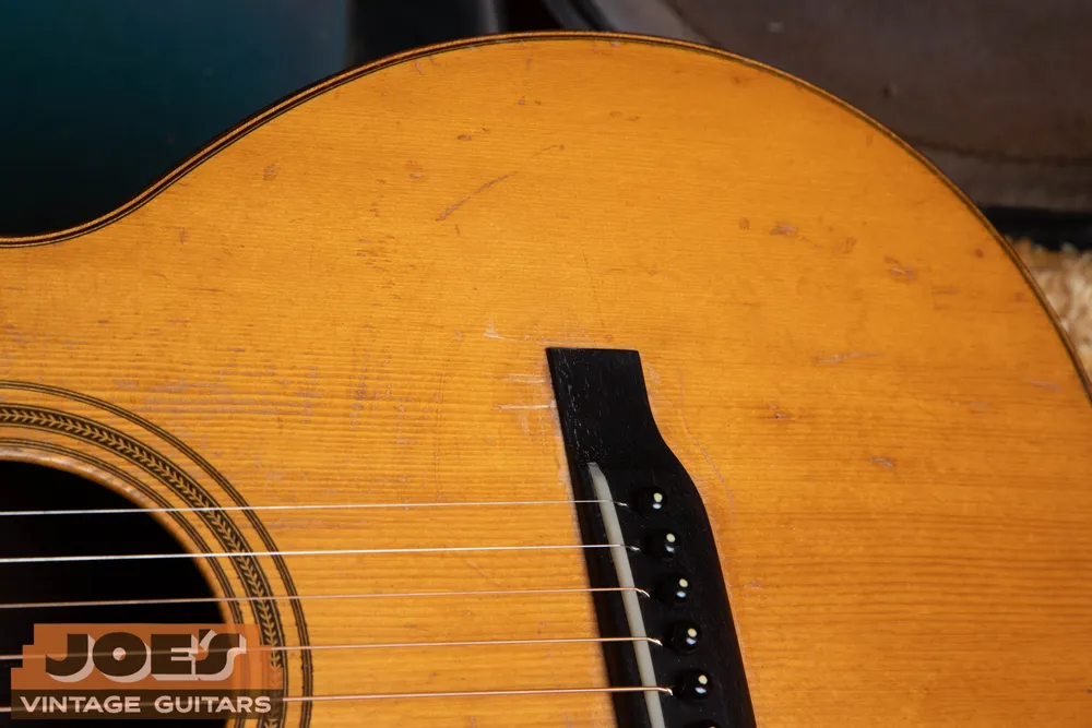 Belly bridge with a curved extension behind the pins on Joe’s 1930 Martin 0-21