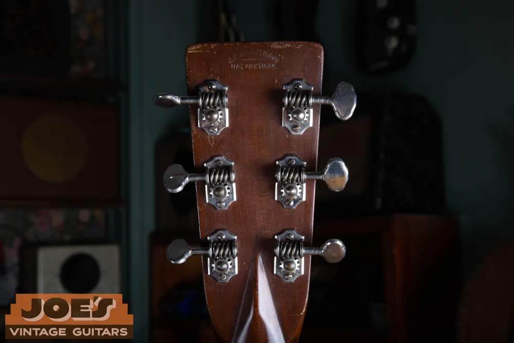 Grover open-gear tuners with clipped-end plates and scalloped metal buttons on the guitar identified by Joe as a 1934 Martin OM-28
