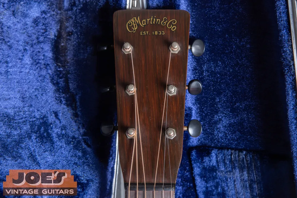 Gold Martin logo with a dark outline on a 1937 Martin 0-17 headstock