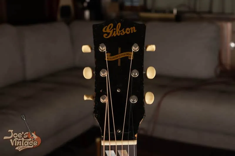 Gold Gibson script and Only a Gibson is Good Enough banner on a 1944 Southern Jumbo headstock