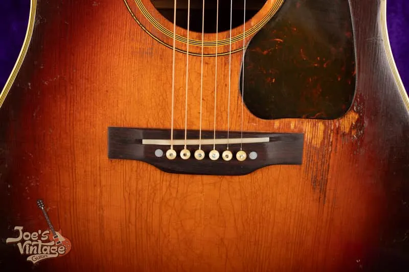 Replacement belly-down bridge, saddle and original pickguard on the listed 1944 Southern Jumbo