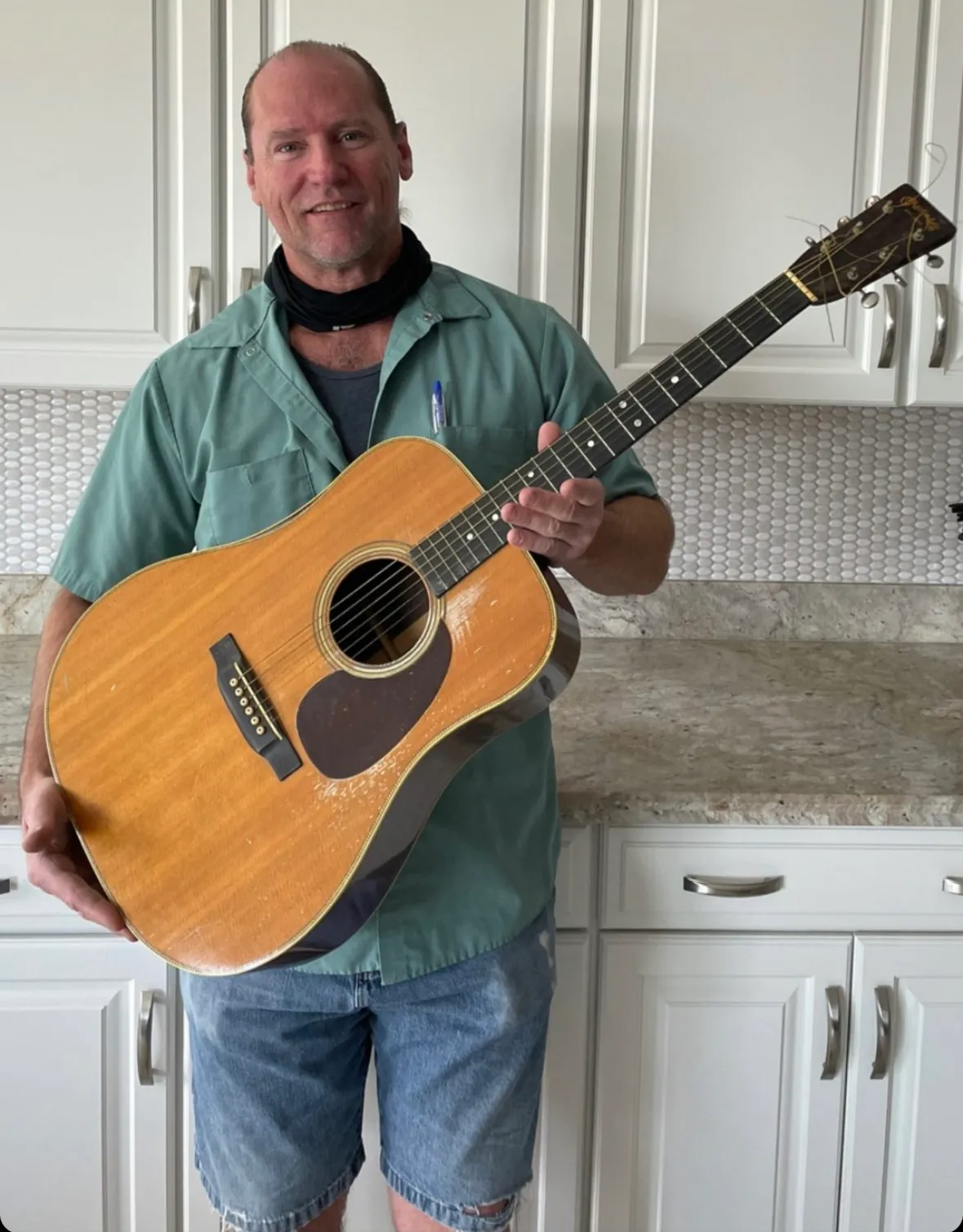 The original owner's grandson in Apache Junction, Arizona, holding the family's 1946 Martin D-28
