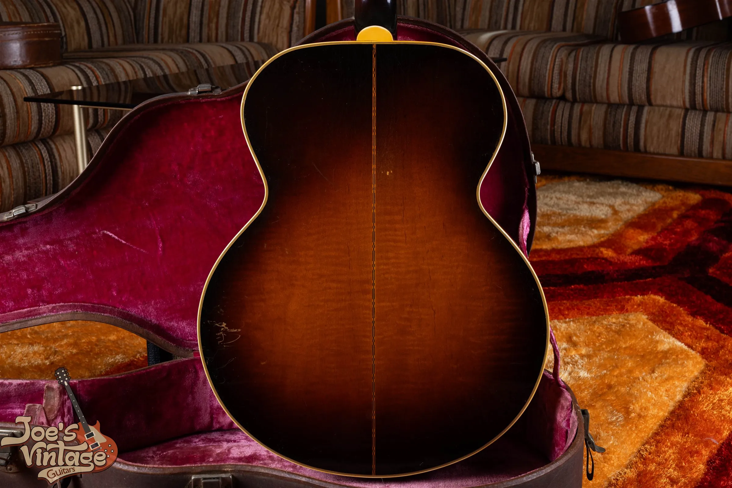 Figured sunburst SJ-200 back with a decorated center strip and visible finish wear