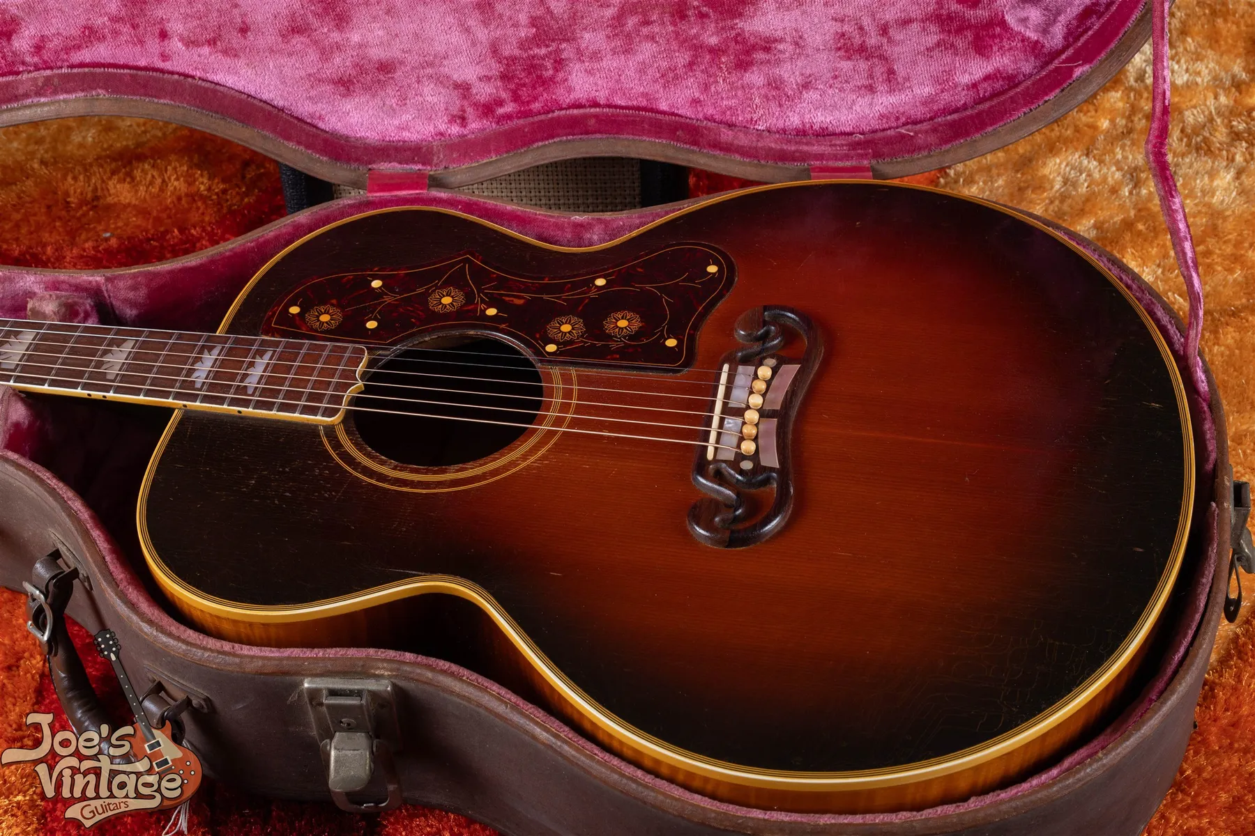 1948 Gibson SJ-200 sunburst acoustic guitar photographed in its case