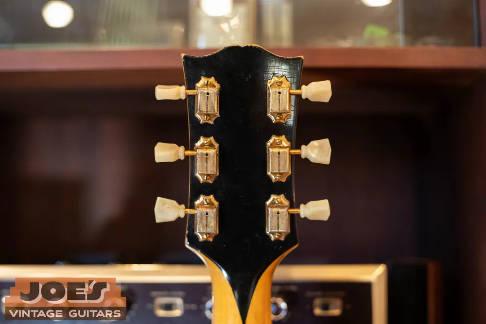 Gold tuners on the back of a 1950s Gibson J-200 headstock
