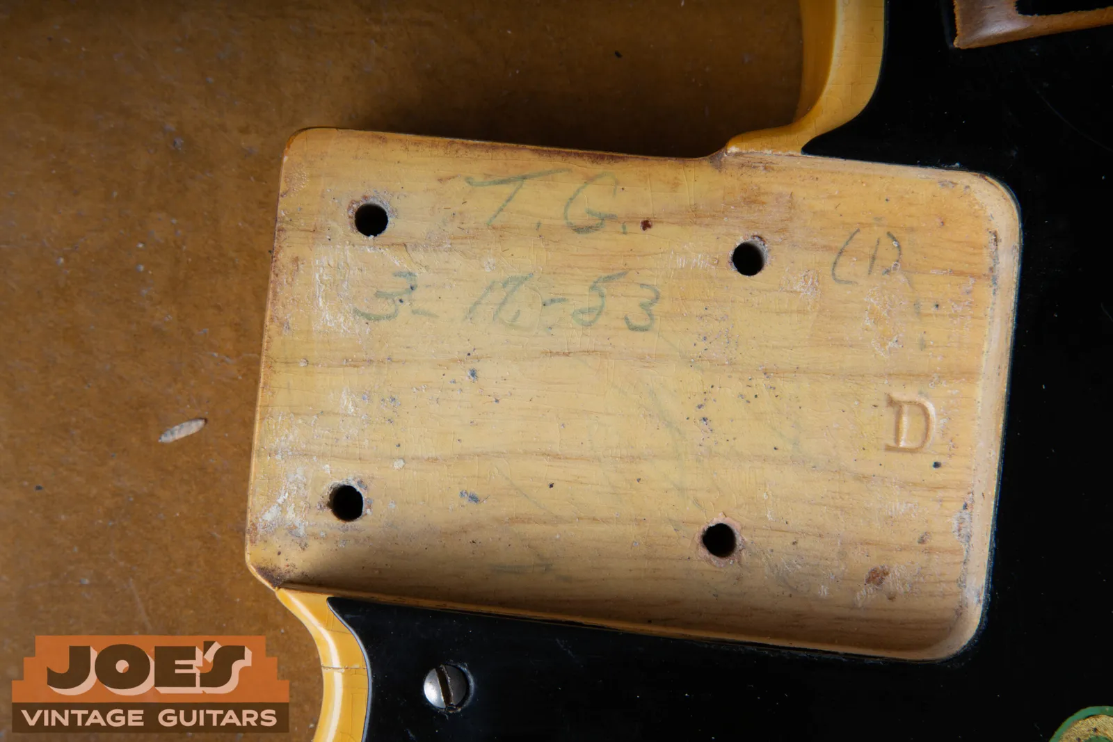 A penciled body date reading 3-16-53 with the worker's initials above it on an early Fender Precision Bass body
