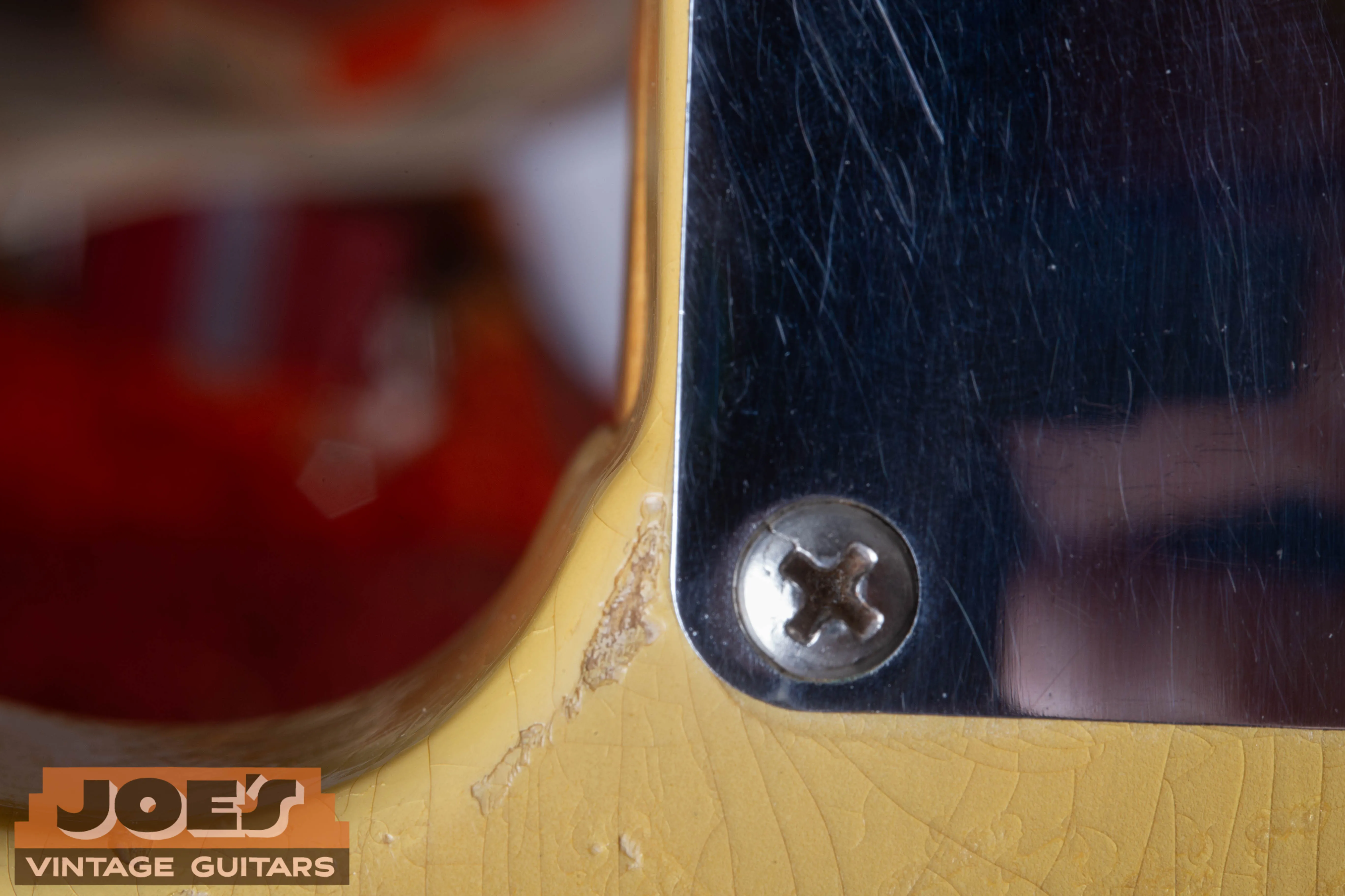 Close-up of a 1952 Fender Telecaster neck cutaway showing the authentic “router hump” in the wood.
