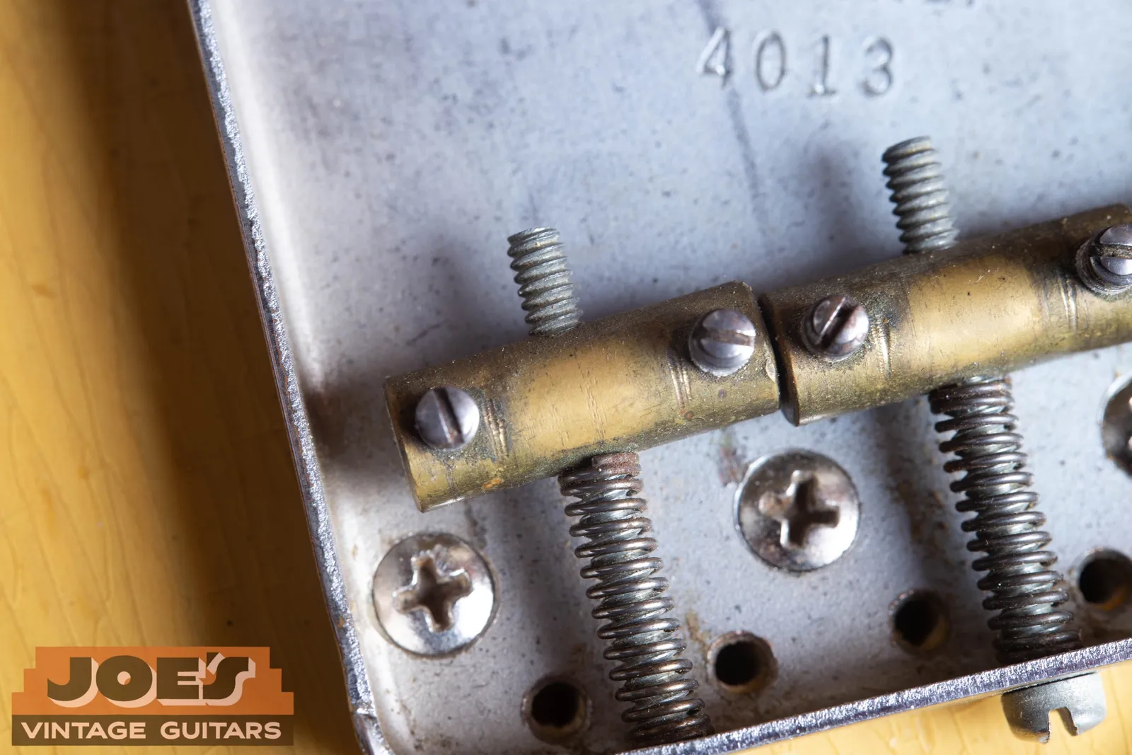 Brass bridge saddles and adjustment screws