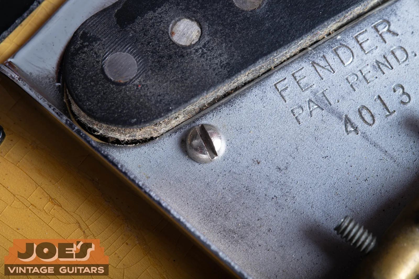 Bridge plate stamped with serial number 4013
