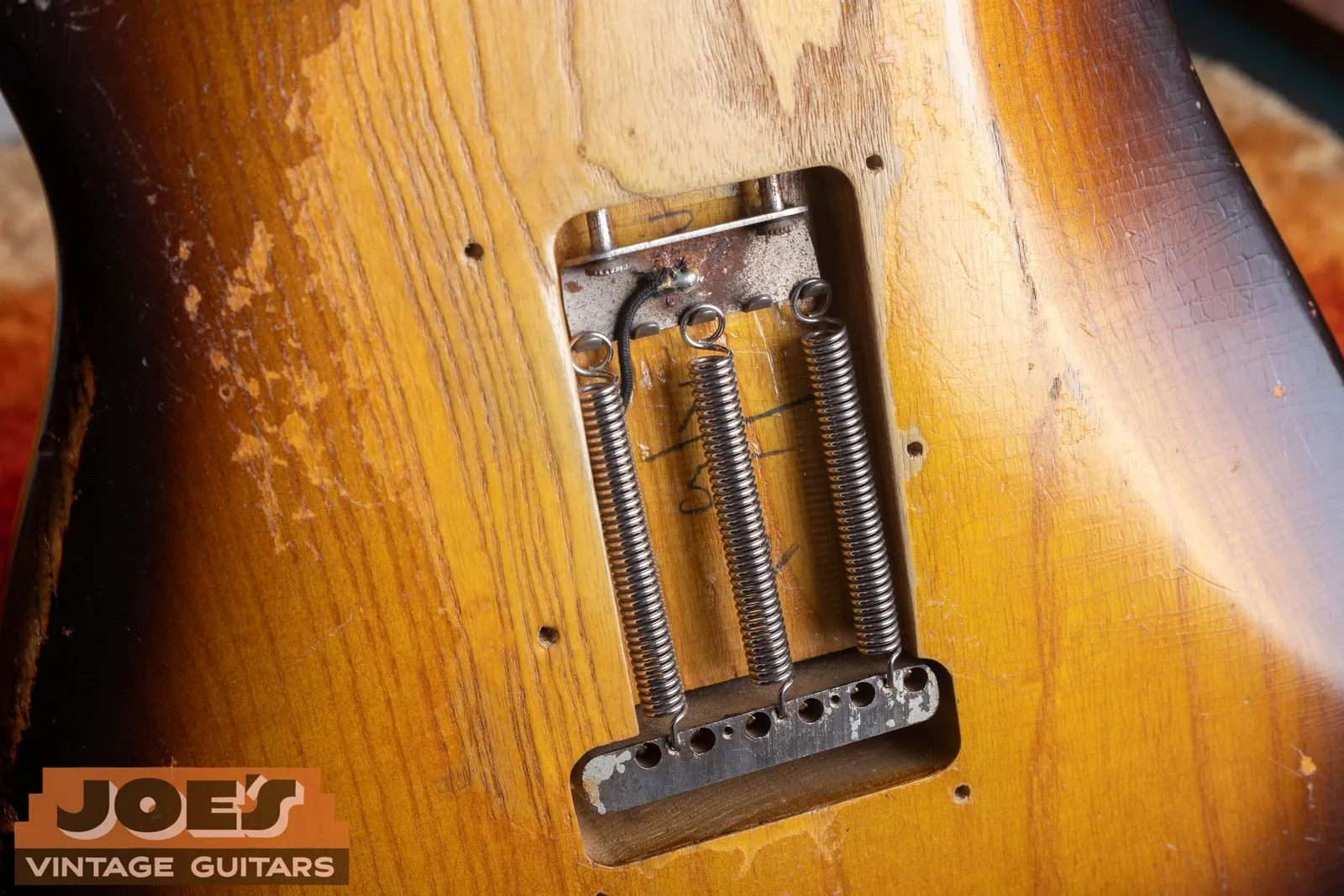 A penciled body date written directly on the body in the rear tremolo spring cavity of a 1955 Fender Stratocaster