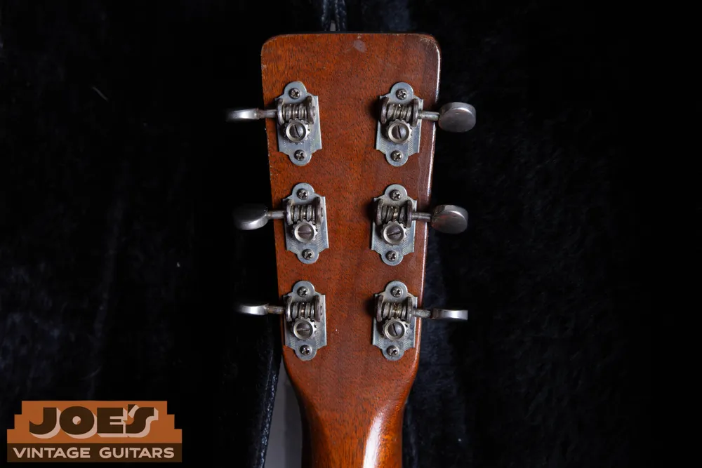 Waverly open-gear tuners with rounded baseplate ends and metal buttons on a 1955 Martin 000-18