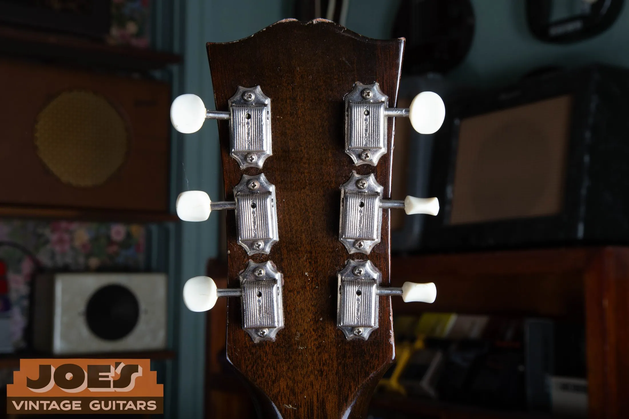 Back of a 1956 Gibson ES-225 headstock showing six Kluson Deluxe tuners