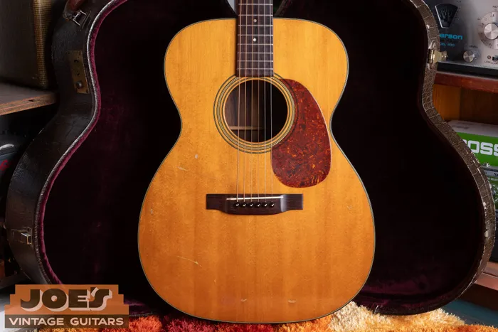 Spruce top, bridge and pickguard of my 1956 Martin 000-21, with visible playing wear