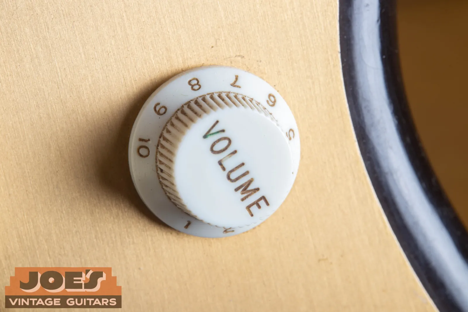 A white skirted plastic knob on a 1959 Fender Jazzmaster lead circuit control