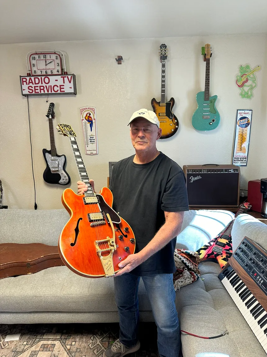 The original owner's son holding the family's 1959 Gibson ES-355