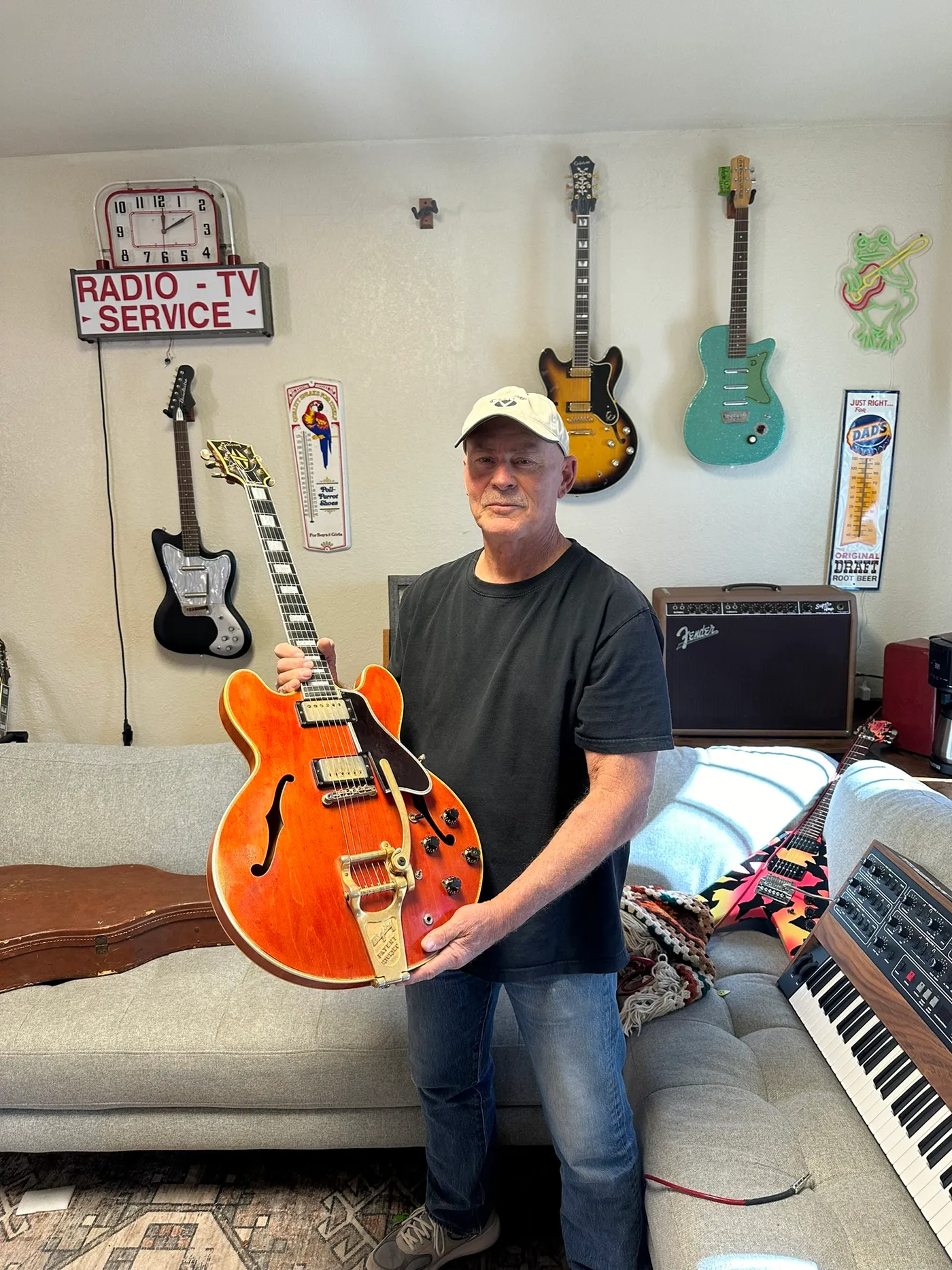 The original owner's son holding the family's 1959 Gibson ES-355