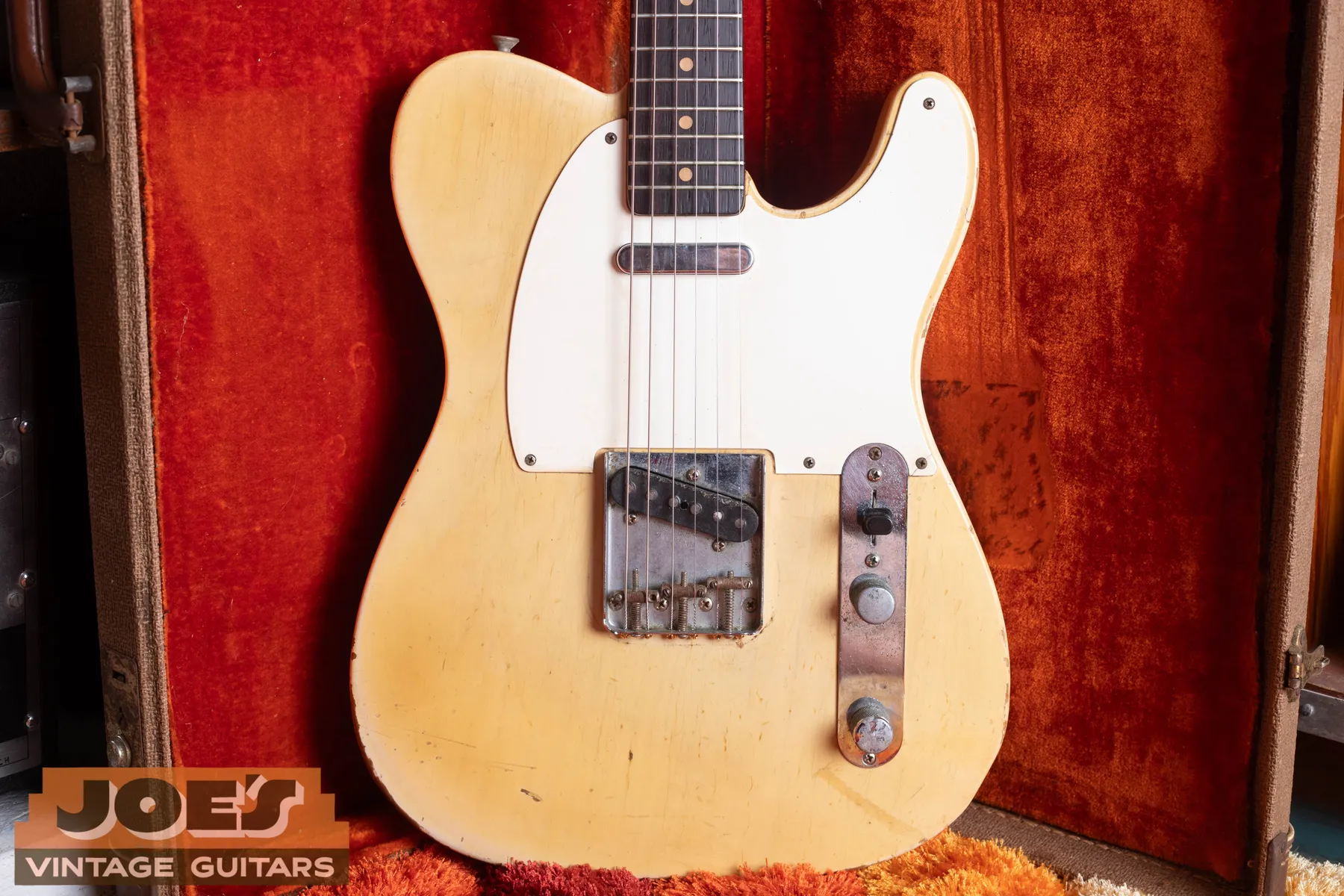 Front of the blonde 1960 Fender Telecaster resting in its red lined hardshell case