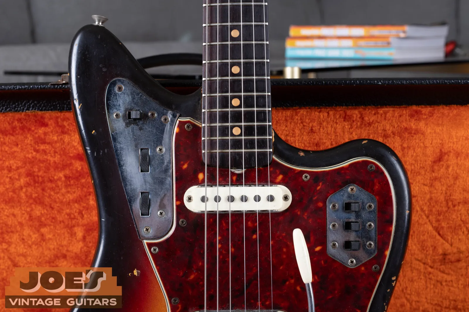 Close up of clay dot fingerboard inlays on a 1960s Fender Jaguar, showing the matte off-white surface