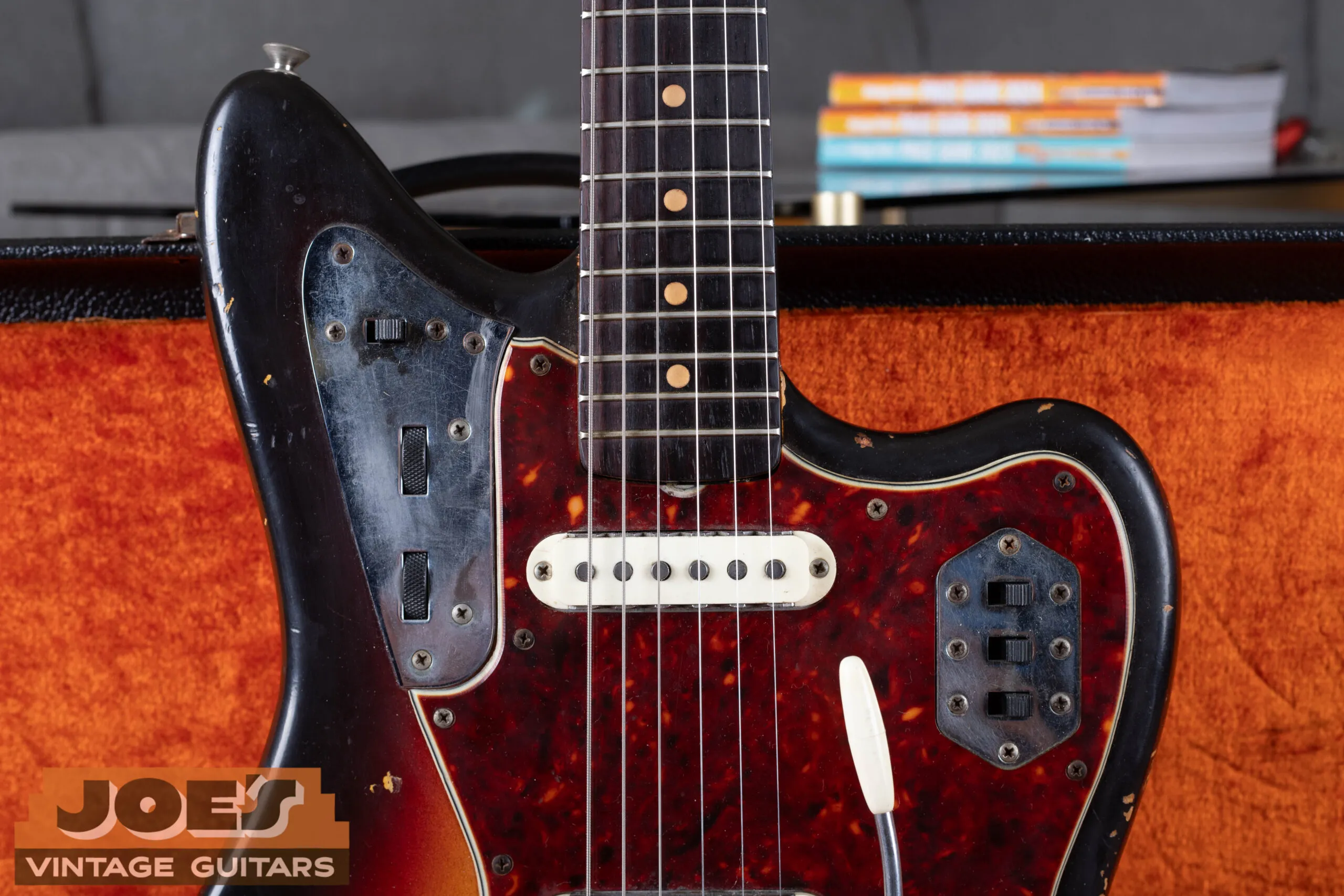 Close up view of clay dot fingerboard inlays on a 1960s Fender Jaguar
