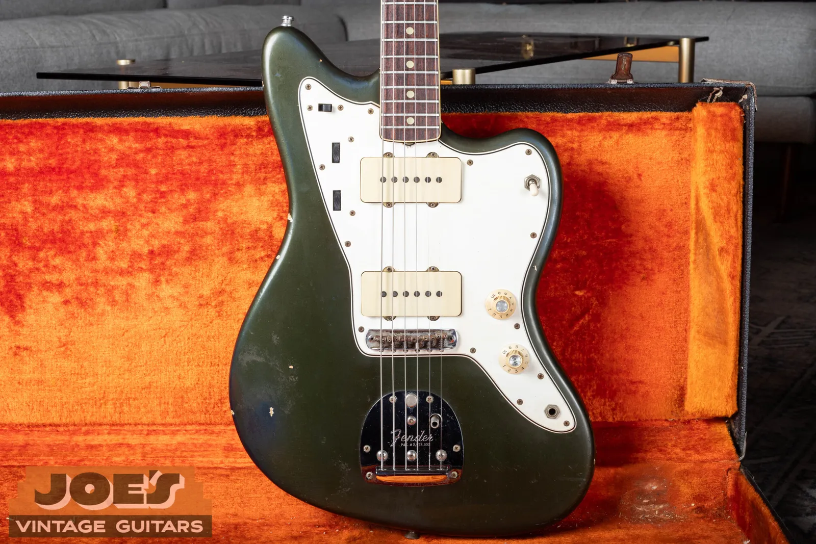 A 1960s Fender Jazzmaster in Charcoal Frost Metallic with a white pickguard, rosewood board, skirted knobs and floating bridge