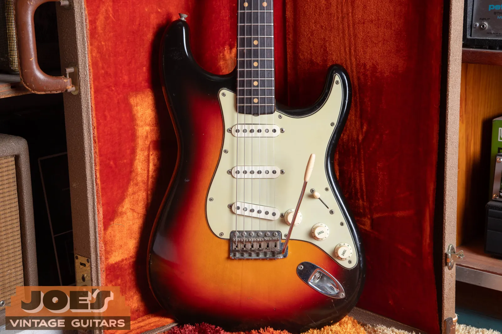 A 1962 Fender Stratocaster in three-color sunburst with a small pre-CBS headstock and a rosewood fingerboard