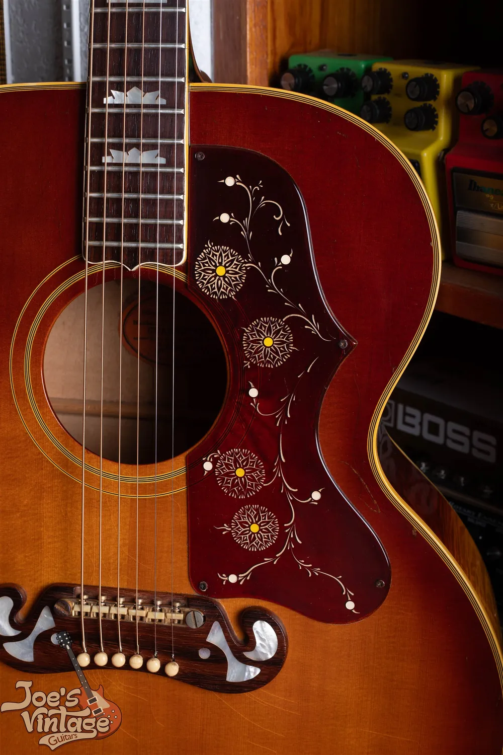 Flower pickguard and closed four-bar bridge on a 1962 Gibson J-200