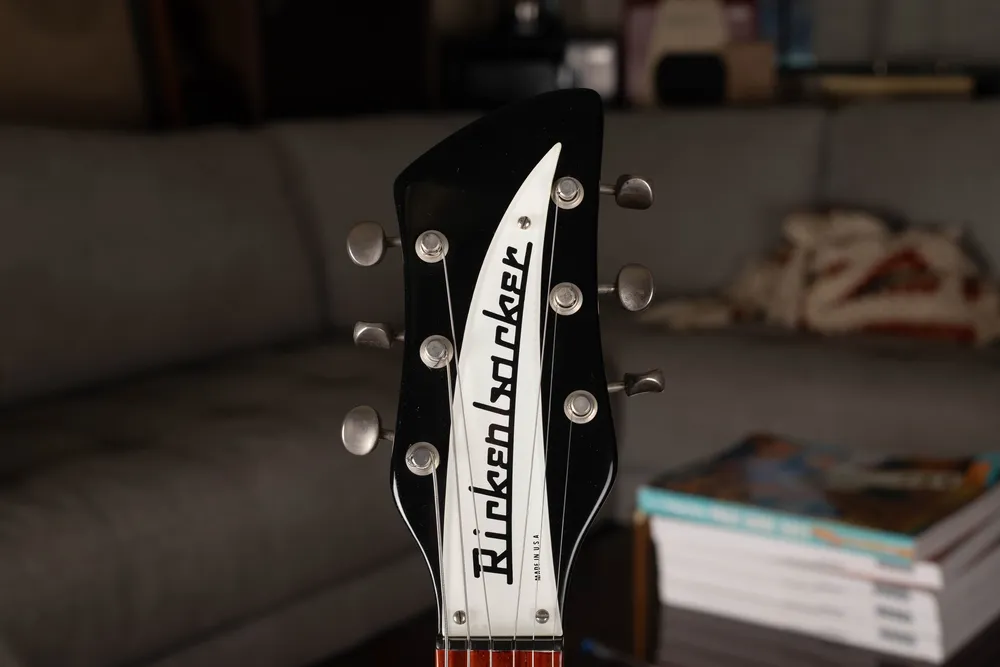 Archive-labeled 1964 Rickenbacker 425 in Jetglo: Headstock front. Record the logo alongside the serial and construction.