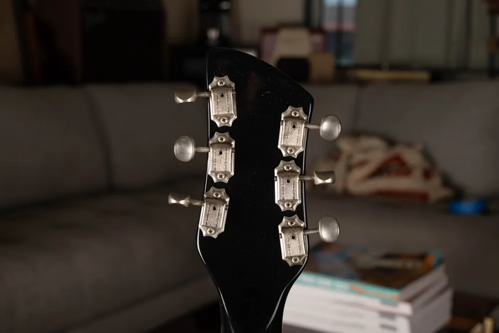 Archive-labeled 1964 Rickenbacker 425 in Jetglo: Rear headstock and tuner mounting. Added holes can remain visible after a tuner change.