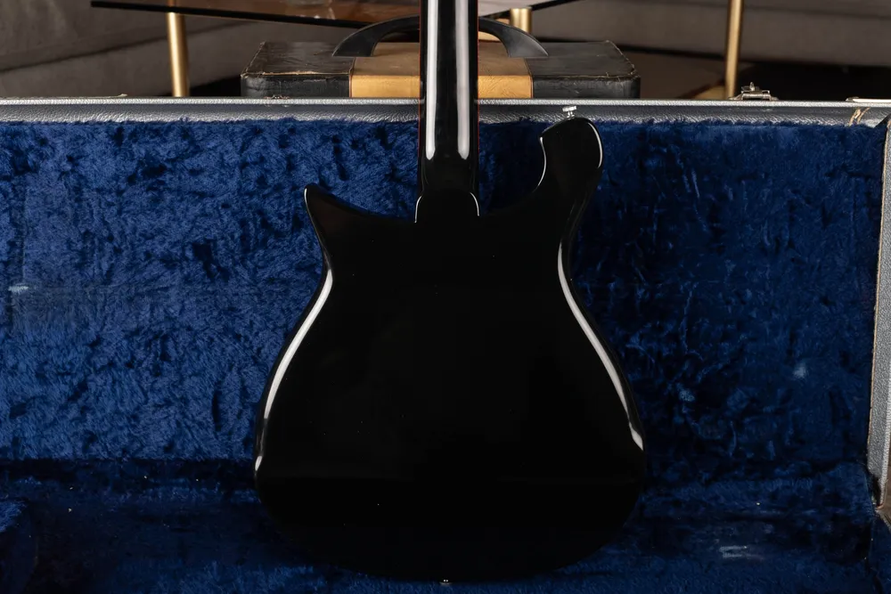 Archive-labeled 1964 Rickenbacker 425 in Jetglo: Body back. Side lighting helps reveal repairs under a dark finish.
