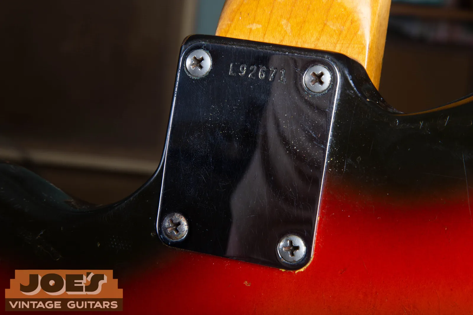The L-prefix serial number stamped into the neck plate of a 1965 Fender Jaguar