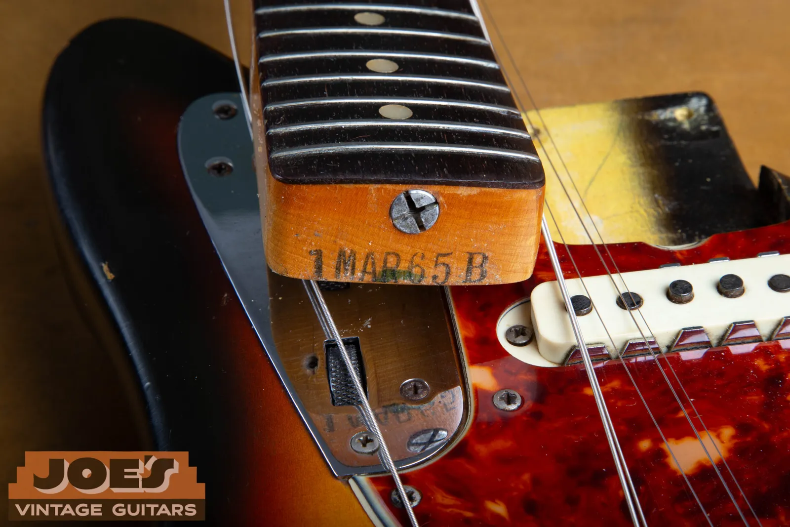 The inked neck heel date stamp on a 1965 Fender Jaguar neck