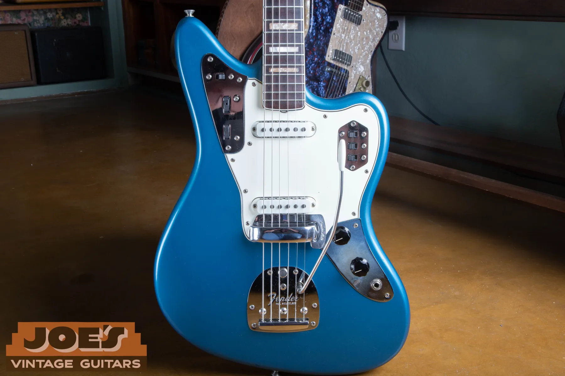 Close front view of the Lake Placid Blue body, white pickguard, chrome control plates, pickups, and vibrato on Bill's 1966 Fender Jaguar