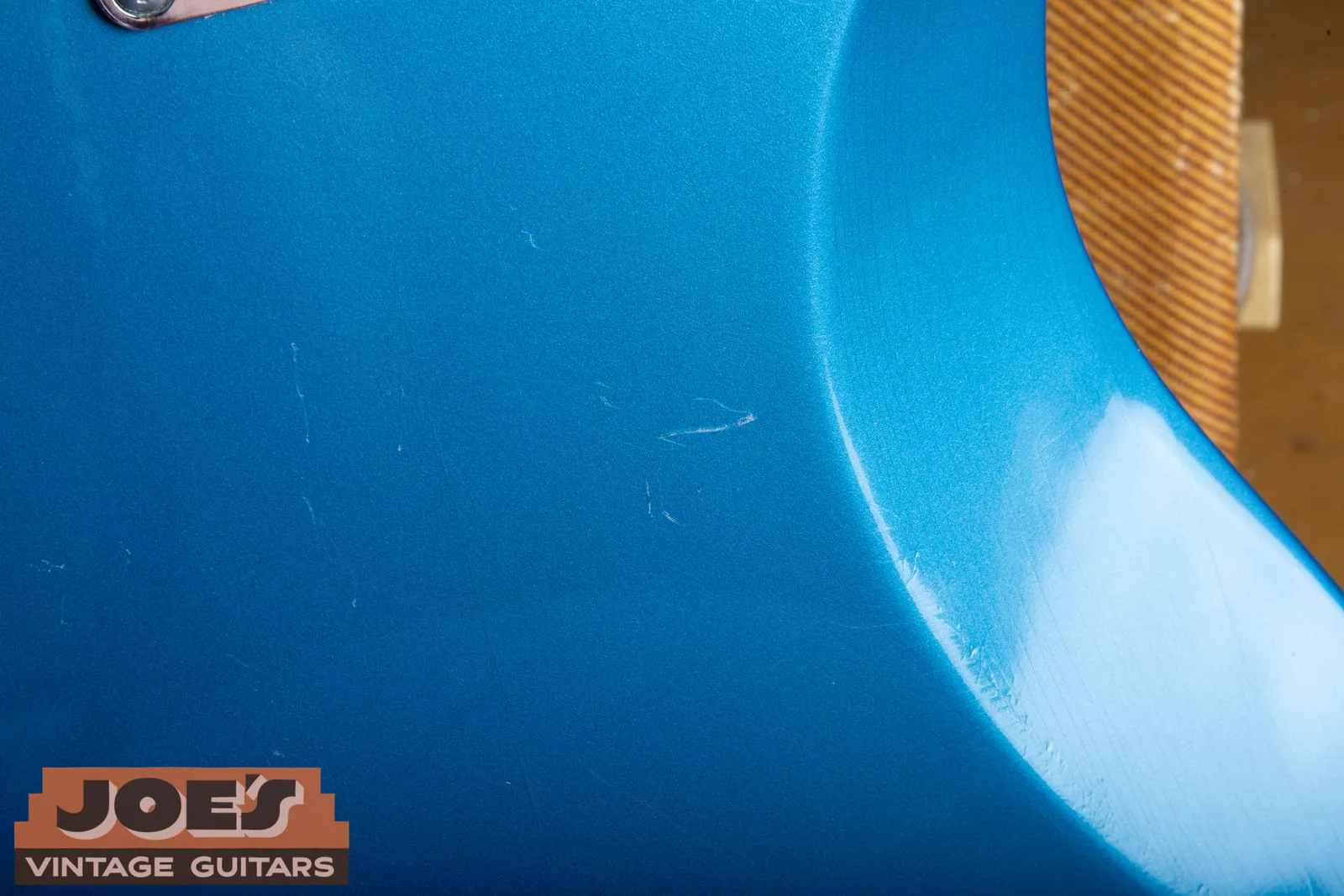 Close view of light handling marks in the original Lake Placid Blue finish on the back of Bill's Jaguar