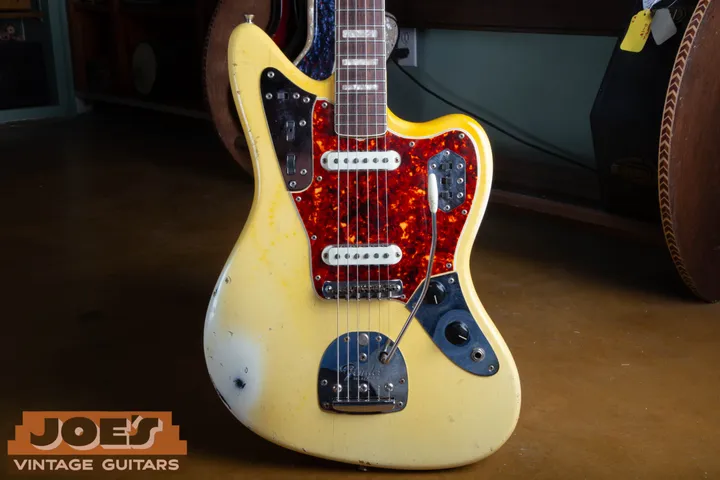 Olympic White-colored Jaguar body with a tortoiseshell pickguard and chrome control plates