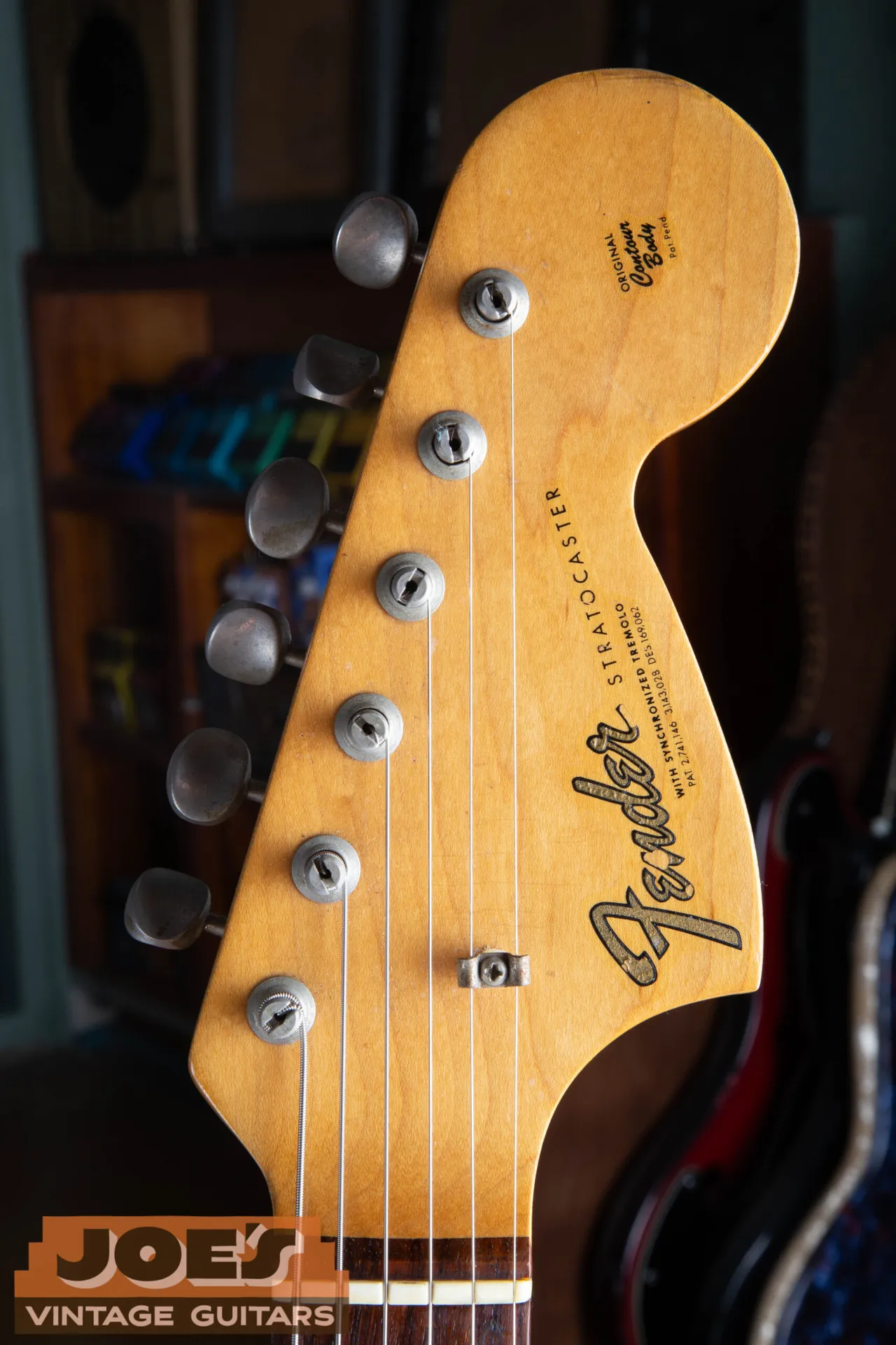 The large CBS headstock of a 1966 Fender Stratocaster with the gold transition logo