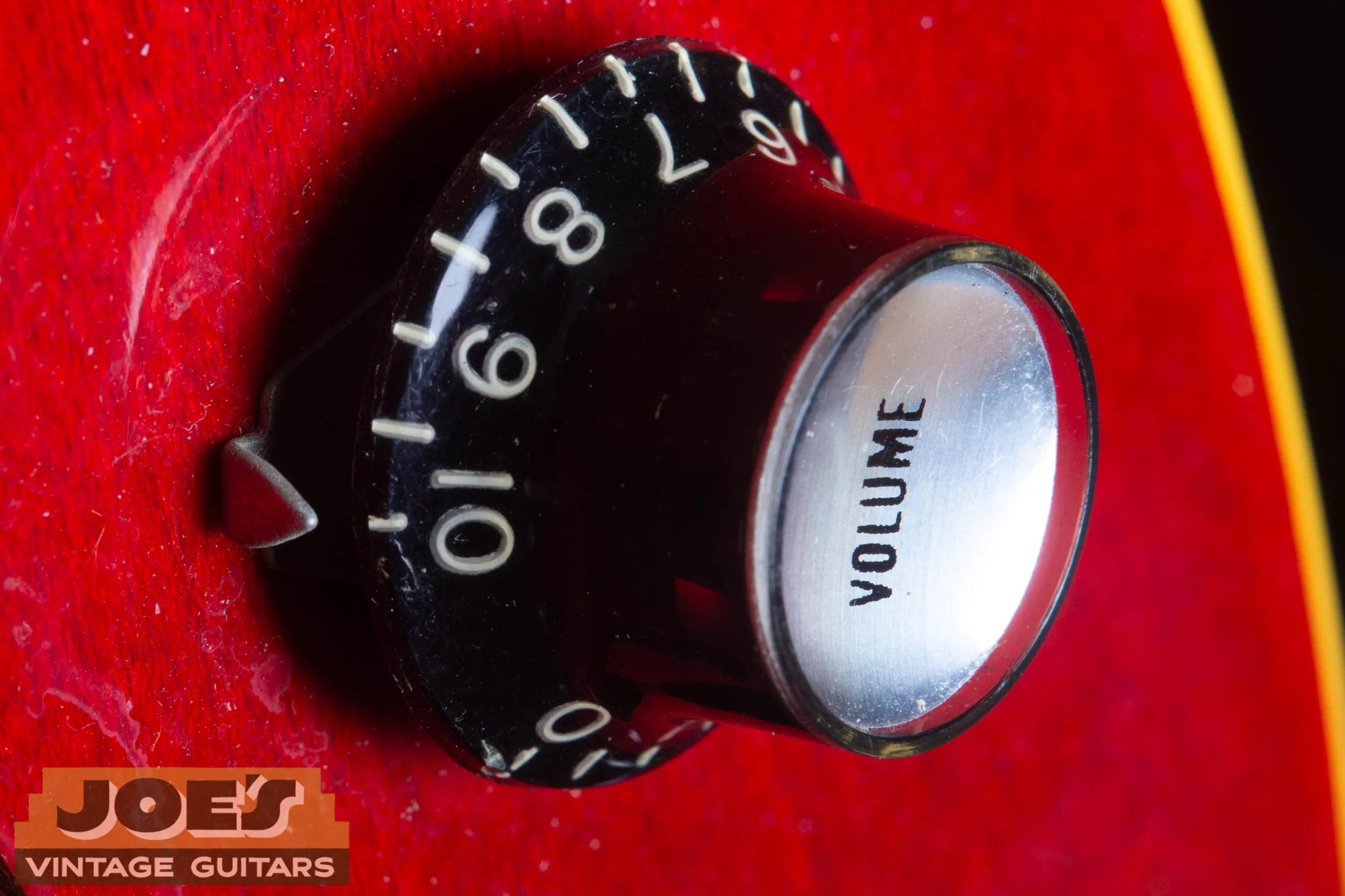 1966 Gibson ES-335 top hat reflector knob close-up, black reflector top with metal skirt, correct for cherry-finish mid-1960s Gibson ES-335