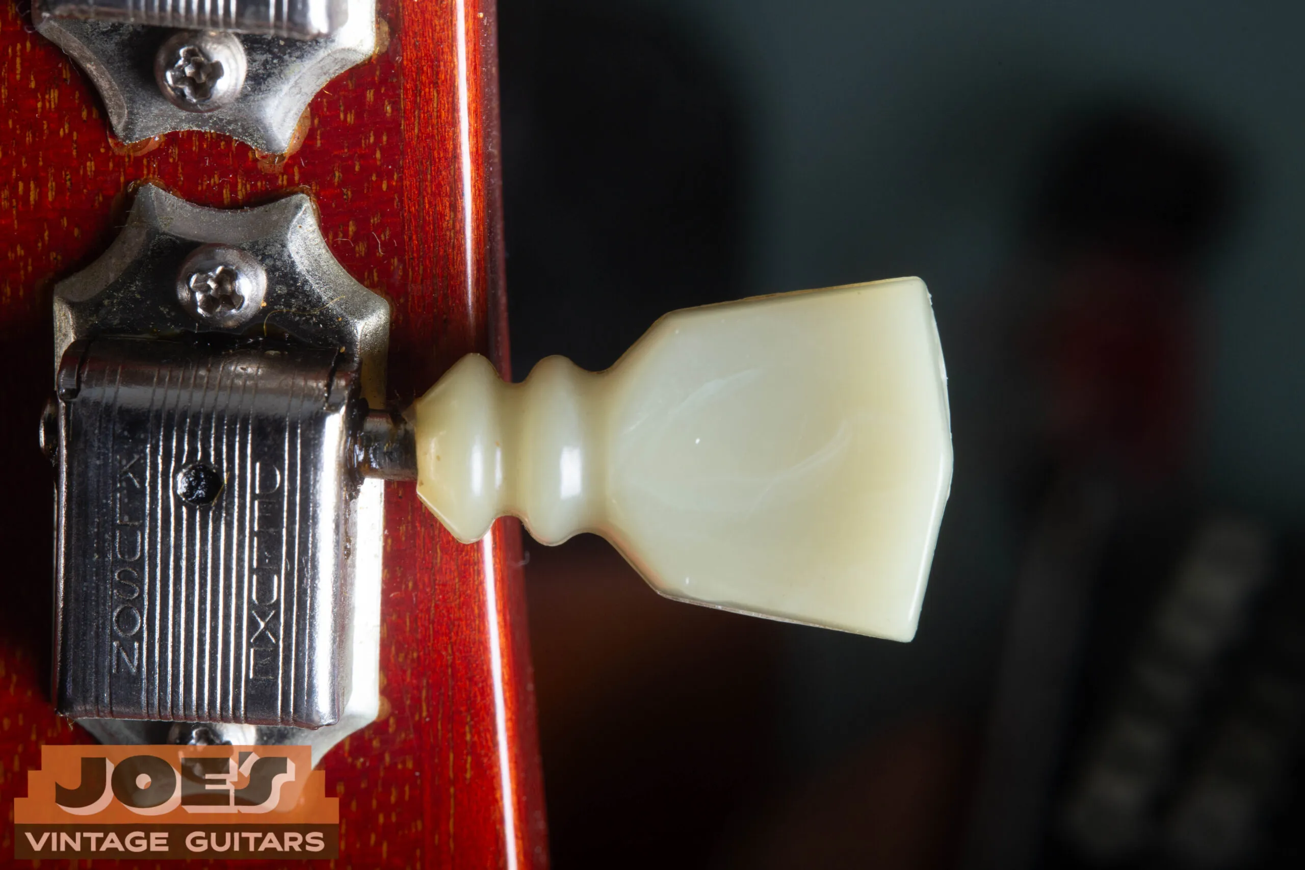 1966 Gibson ES-335 Kluson Deluxe double-ring tuner button close-up, all-metal button with two concentric raised rings, correct for mid-1960s Gibson