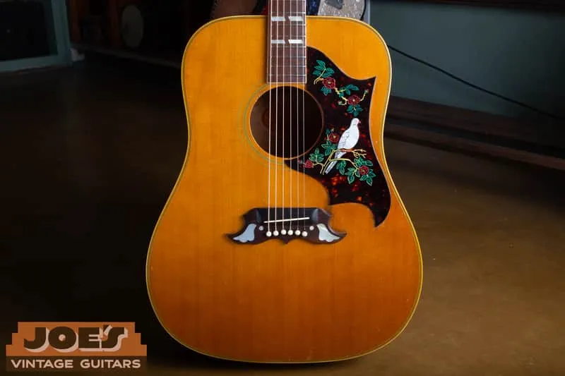 Natural 1968 Gibson Dove from Joe’s Reverb listing with a converted fixed saddle and reproduction bird pickguard