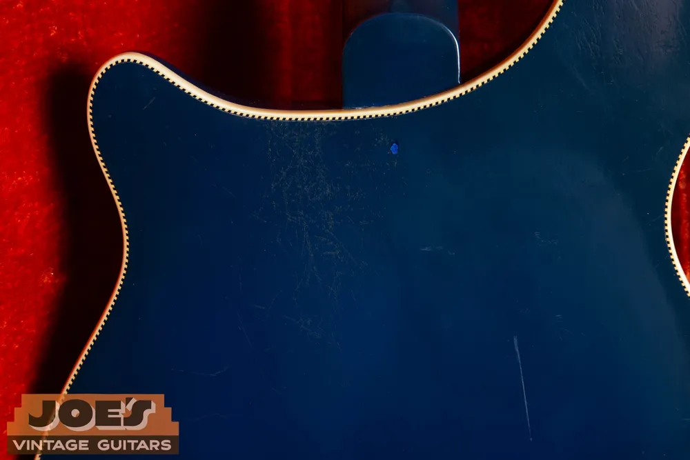 Joe’s 1968 Rickenbacker 4005 in Azureglo: Upper back and decorative binding with visible wear. Separate surface wear from structural damage.