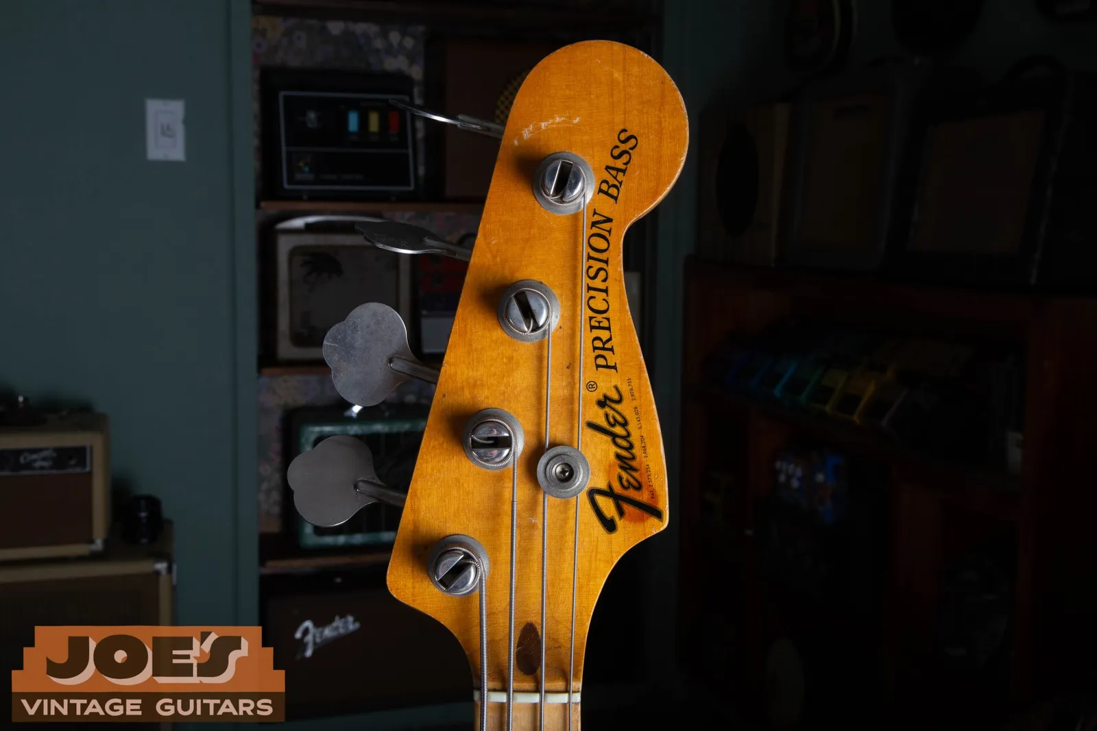 The headstock of a 1971 Fender Precision Bass showing the bold black CBS logo with a registered trademark symbol and patent numbers