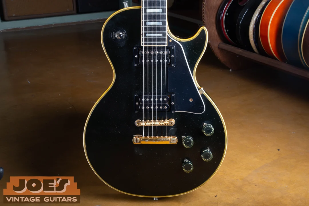 Black 1972 Gibson Les Paul Custom with the covers removed from two full-size humbuckers