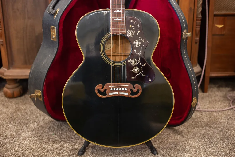 Ebony 1986 Gibson J-200 full front in its red-lined case