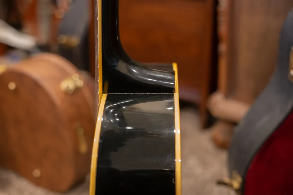 Neck heel and body binding on an ebony 1986 Gibson J-200