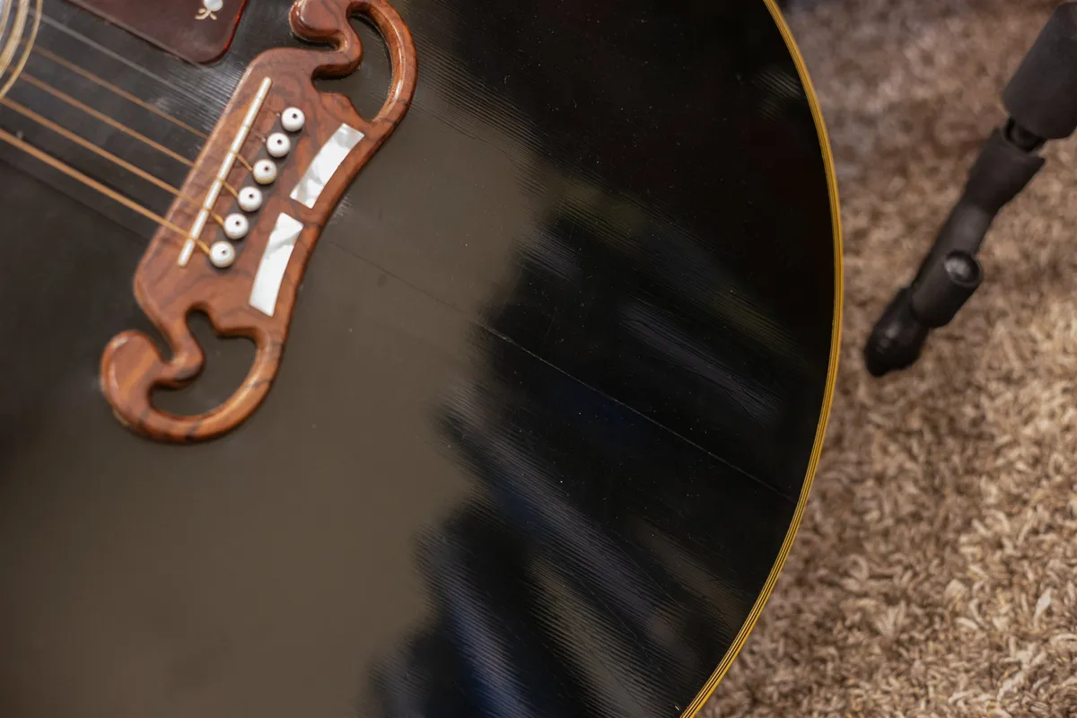 Two-bar moustache bridge on an ebony 1986 Gibson J-200
