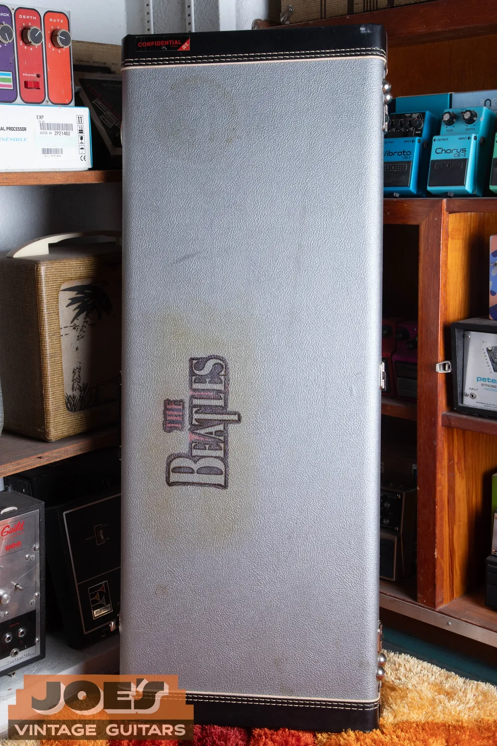 1997 Rickenbacker 325, later-production comparison: Silver case. Photograph the case separately; its appearance alone cannot date the guitar.
