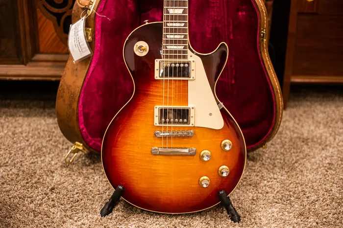 2014 Gibson R0 reissue with a figured sunburst top and reflector knobs; not a vintage 1960 Les Paul