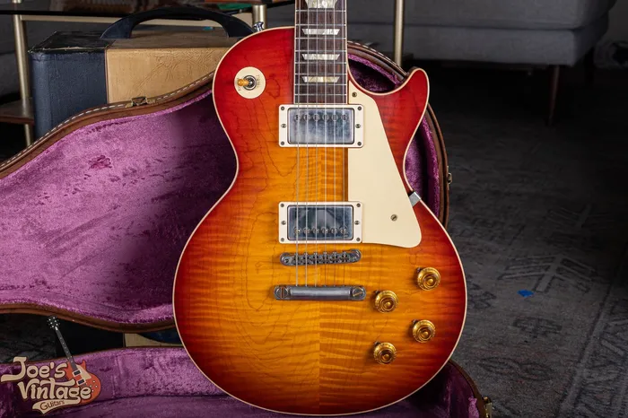 2022 Gibson R9 reissue with a figured sunburst maple top and two covered humbuckers; not a vintage 1959 Les Paul