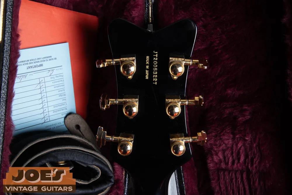 JT-prefixed serial on the rear of the same Black Falcon headstock