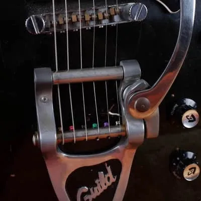 Added Guild-branded Bigsby on Joe’s black Bluesbird