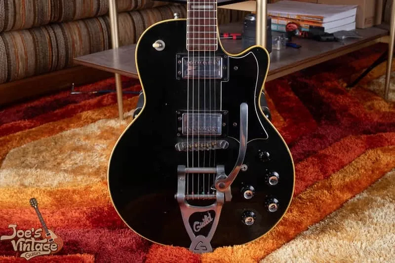 Vintage black Guild Bluesbird fitted with a later Bigsby